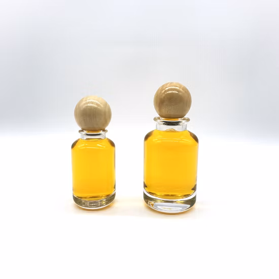 Bottiglia di profumo in vetro cilindrico da 50 ml da 100 ml di vendita calda con tappo rotondo in legno